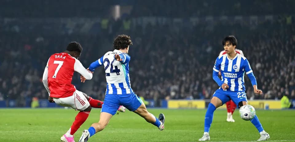 Saka striking the ball during Brighton vs Arsenal match