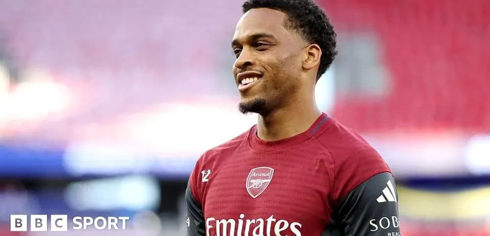 Player smiling in Arsenal training kit before match