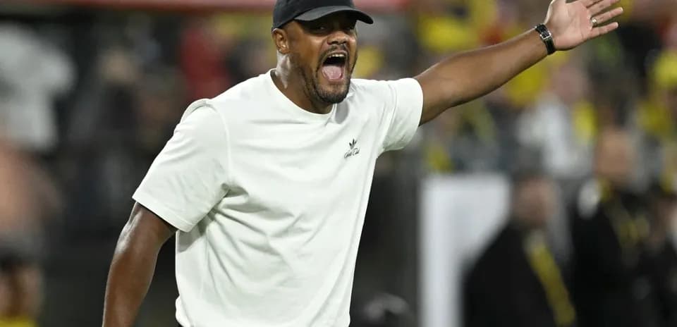Coach gesturing during a match on the sidelines