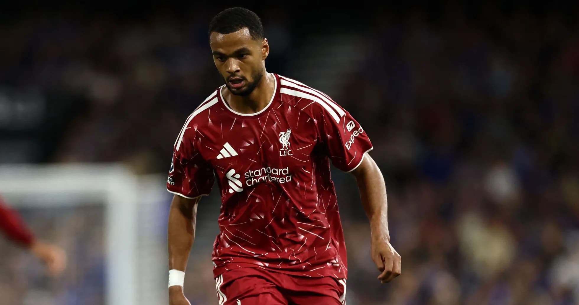 Player in red Liverpool kit running on the pitch