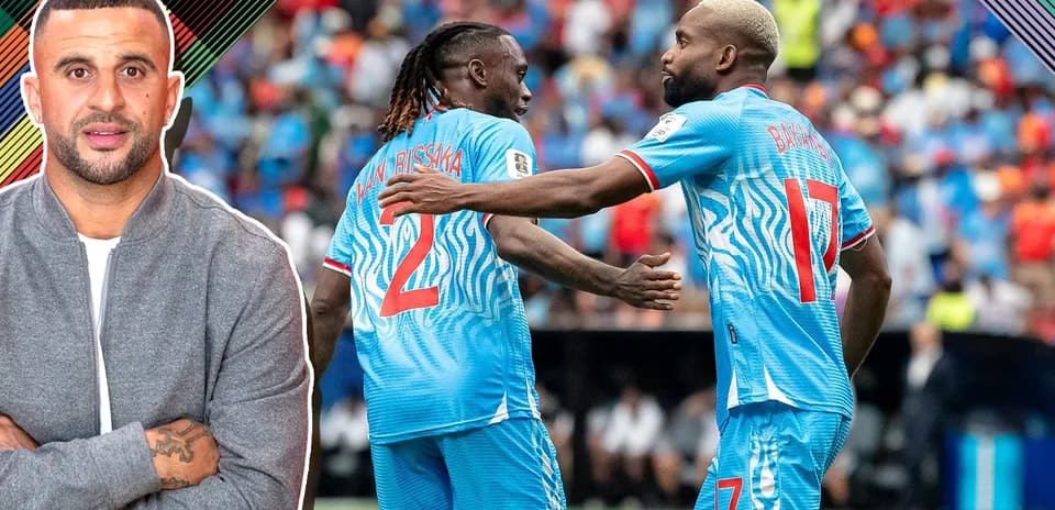 Players celebrating during a match in blue kits