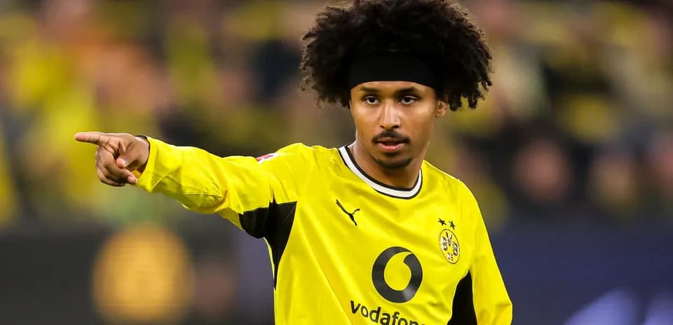 Player pointing during a match in yellow kit