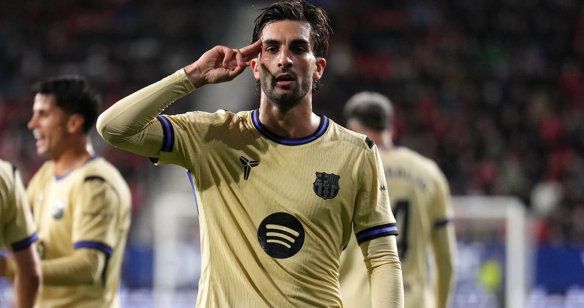 Player celebrating a goal with a salute gesture