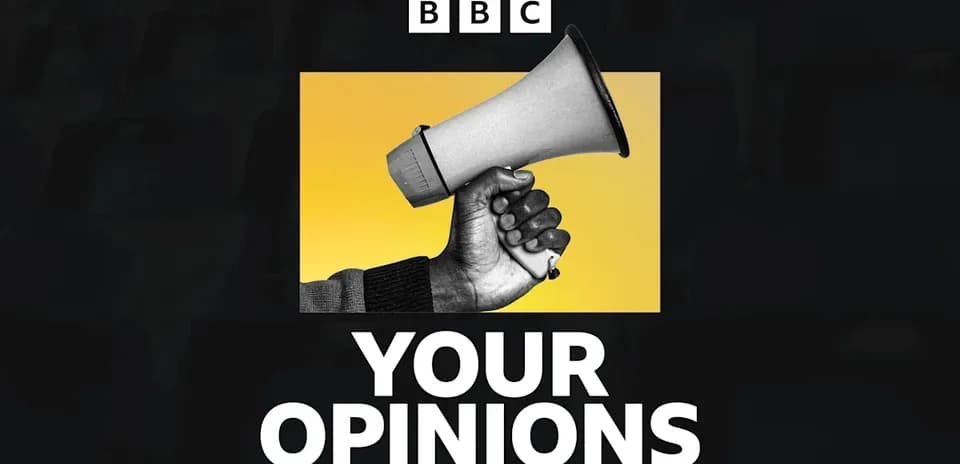 Hand holding a megaphone with yellow background