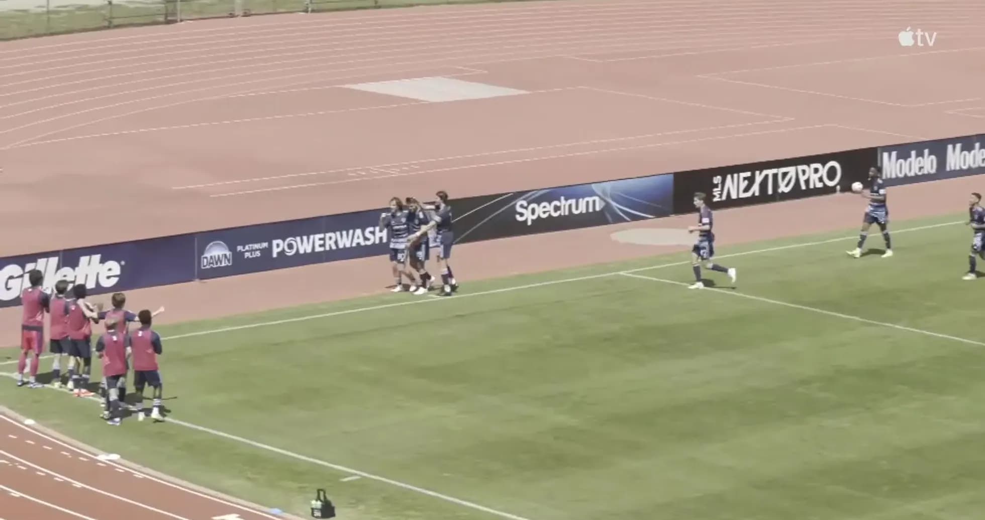 Players celebrating a goal during match
