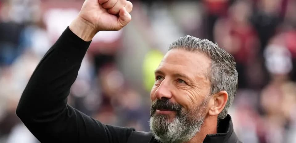 Coach celebrating with raised fist after match
