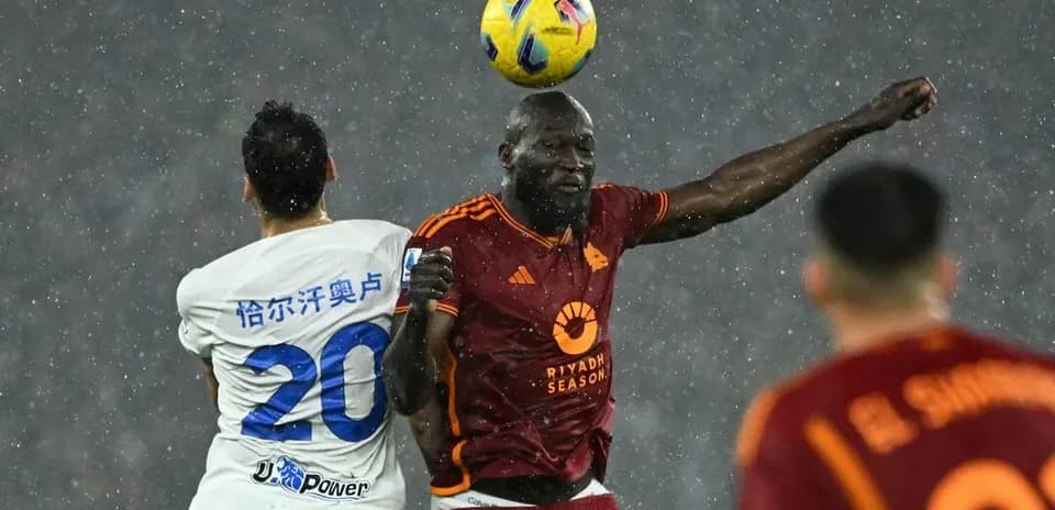 Players contesting for the ball during match