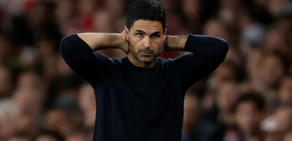 Manager with hands on head during match