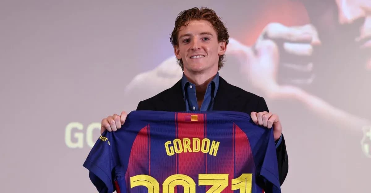 Player holding FC Barcelona jersey at presentation
