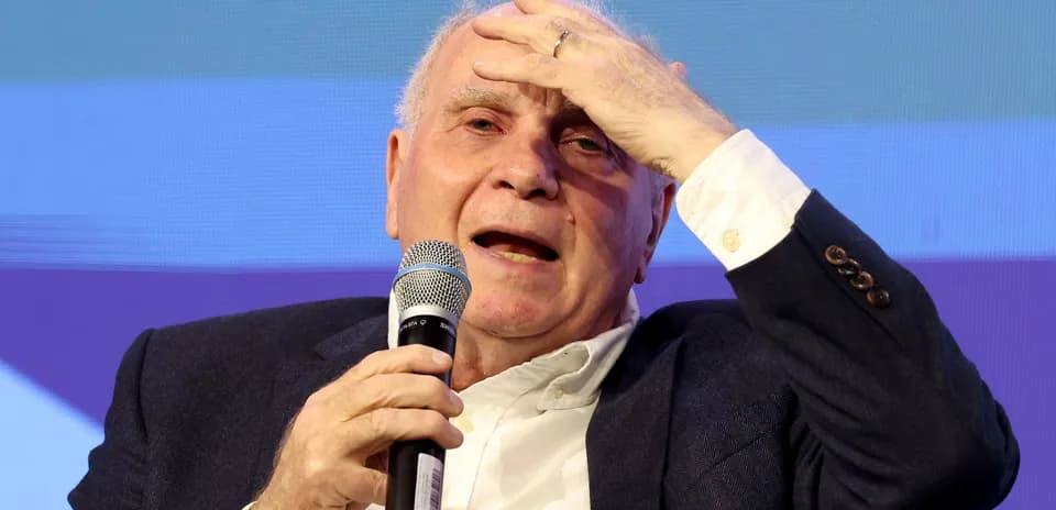 Speaker holding microphone during a discussion event