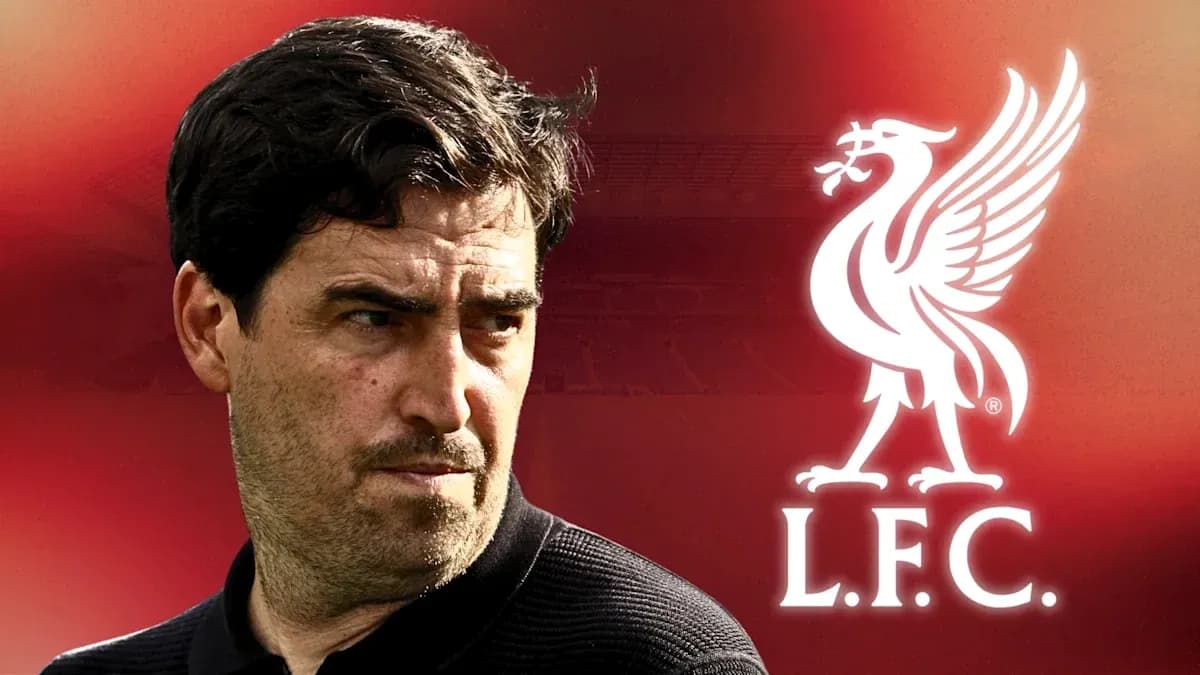 Coach with Liverpool FC logo in background