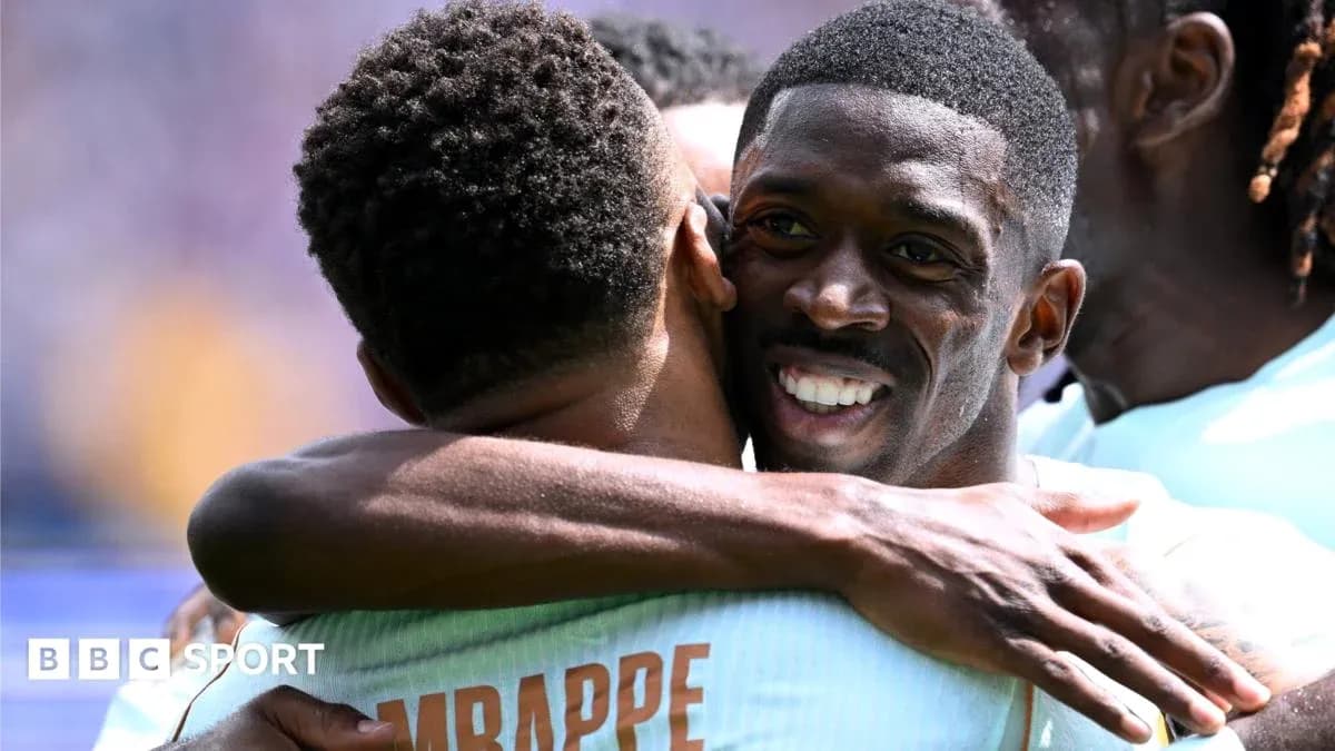 Players celebrating with a hug during match