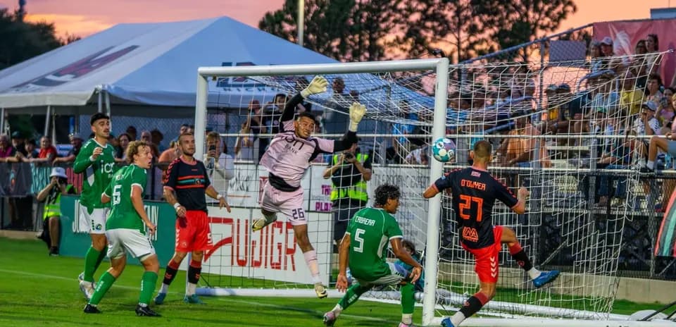 Goalkeeper making a save during USL match