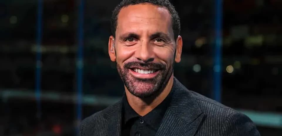 Sports analyst smiling during broadcast segment