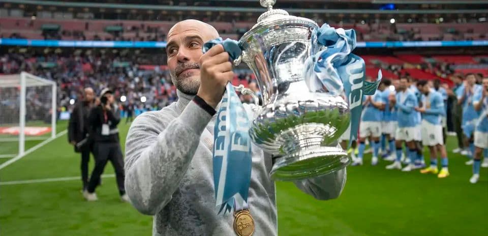 Coach holding trophy after winning the match