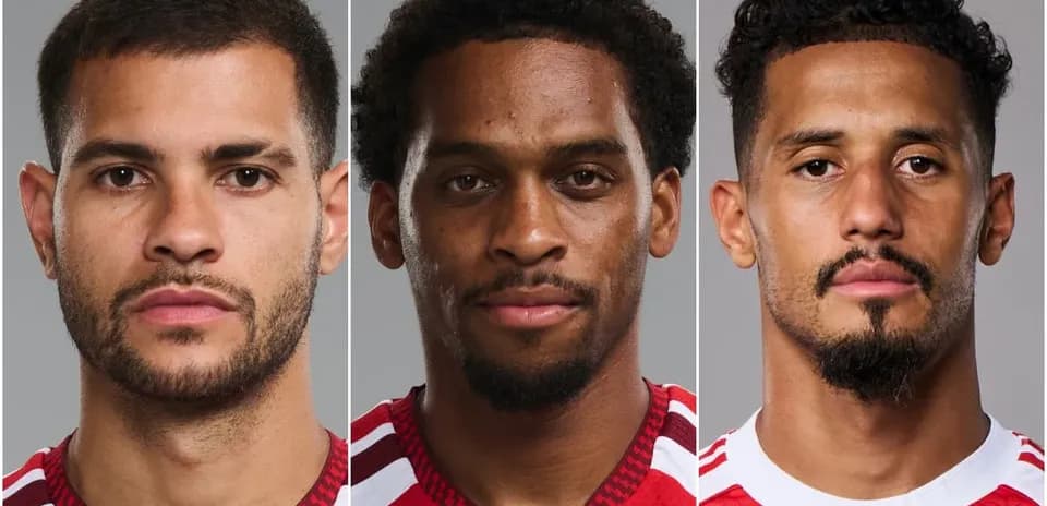 Three football players posing for headshots