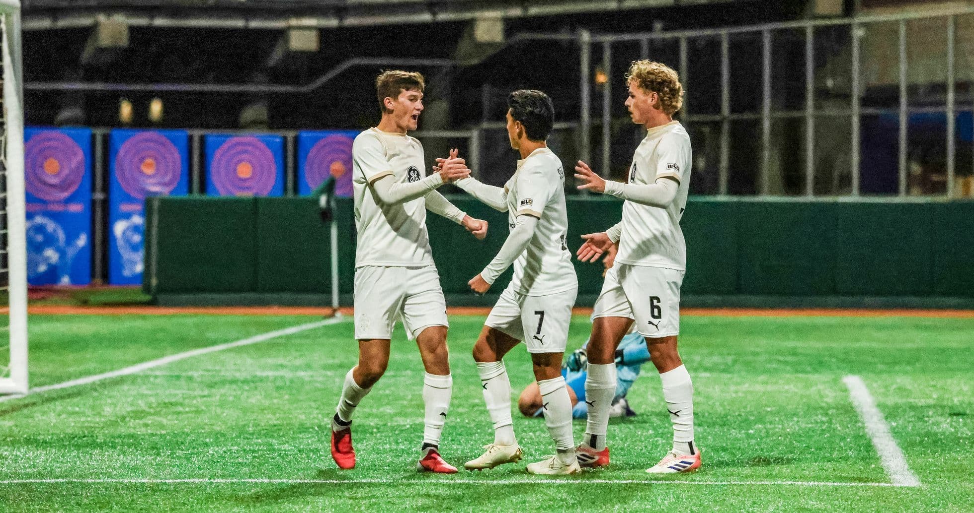 Players celebrating a goal during football match