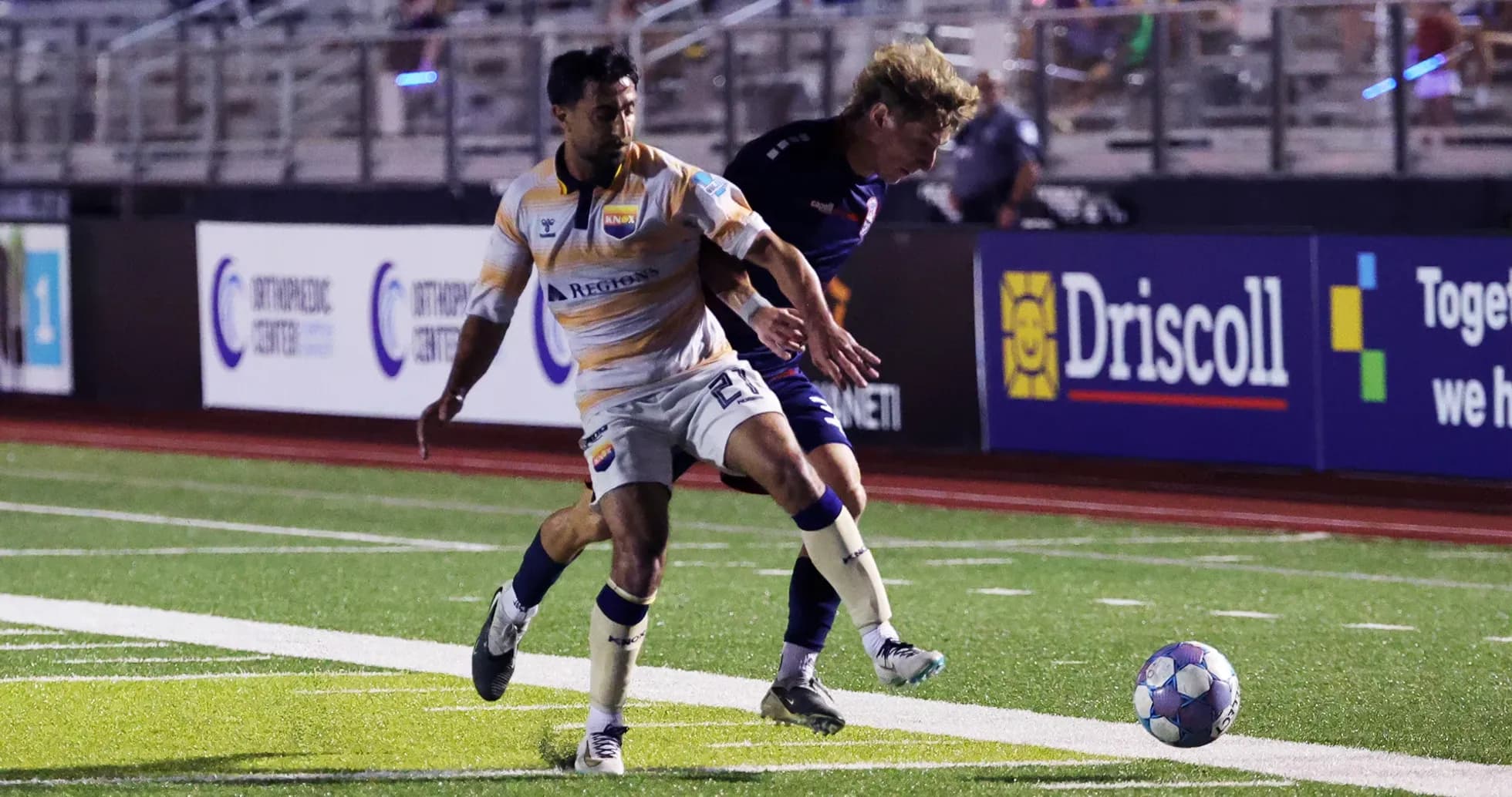 One Knoxville player dribbling the ball