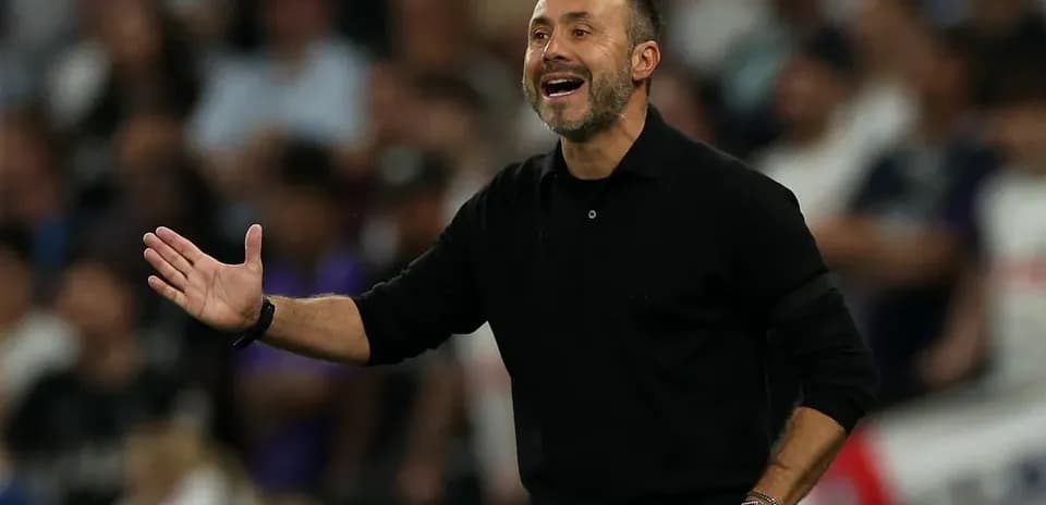 Coach gesturing during a match from the sidelines