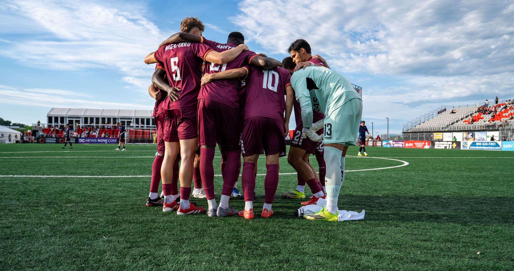Players huddled before the match