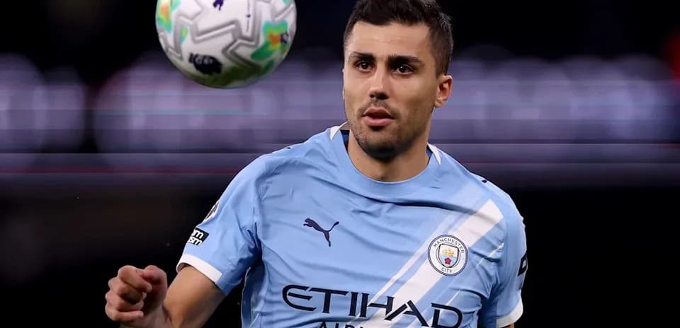 Player in light blue jersey receiving a football