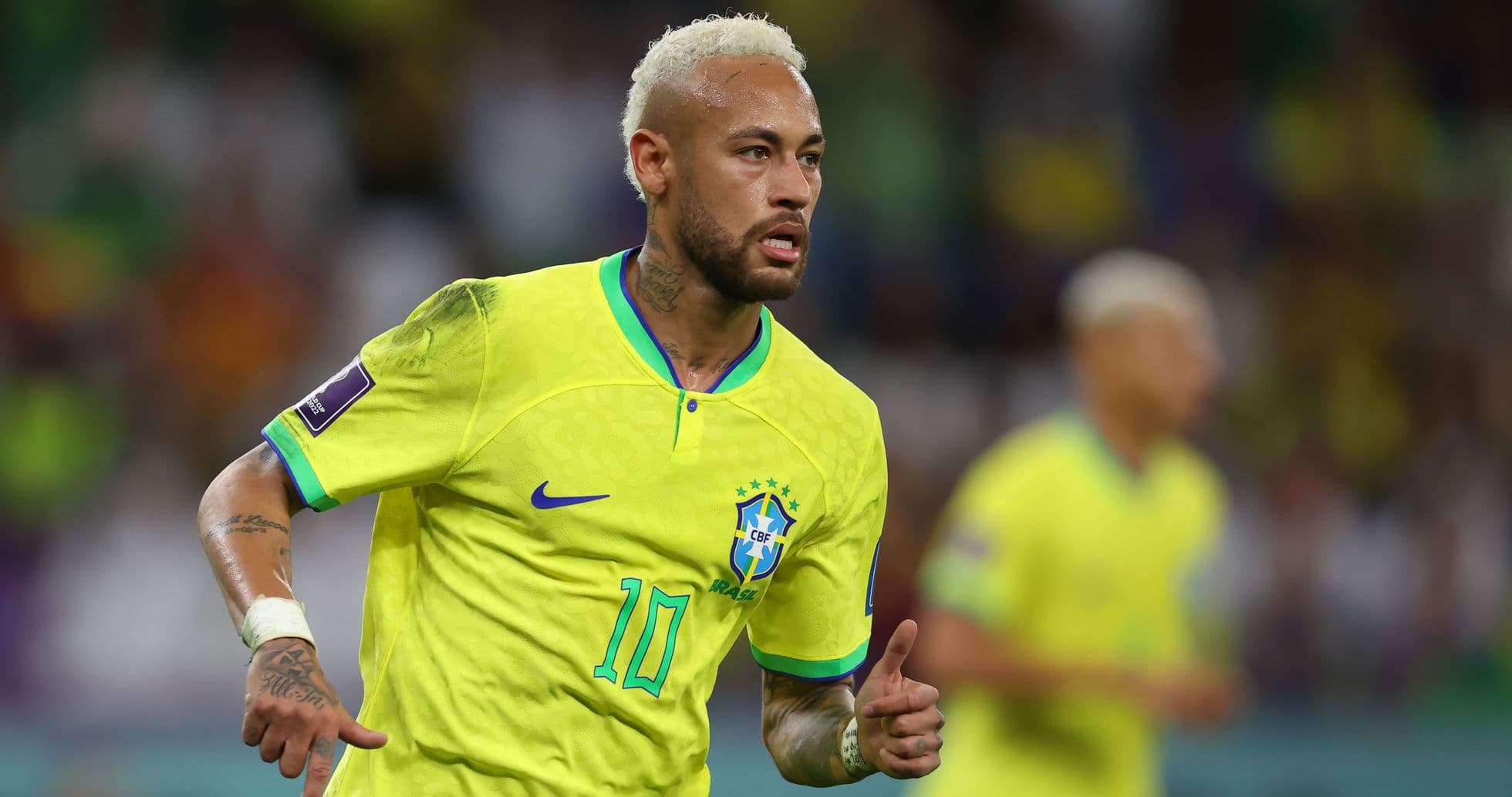Neymar celebrating a goal in Brazil's yellow kit
