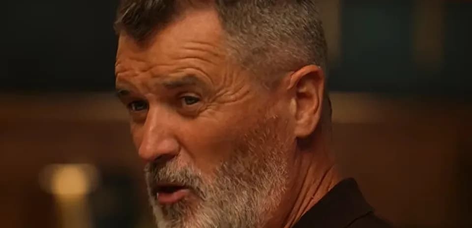 Man with a beard speaking in a casual setting