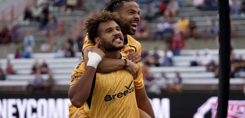 Indy Eleven players celebrating a goal