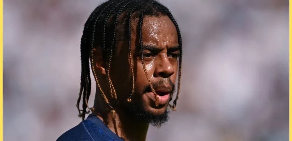 Player with braided hair during match warm-up