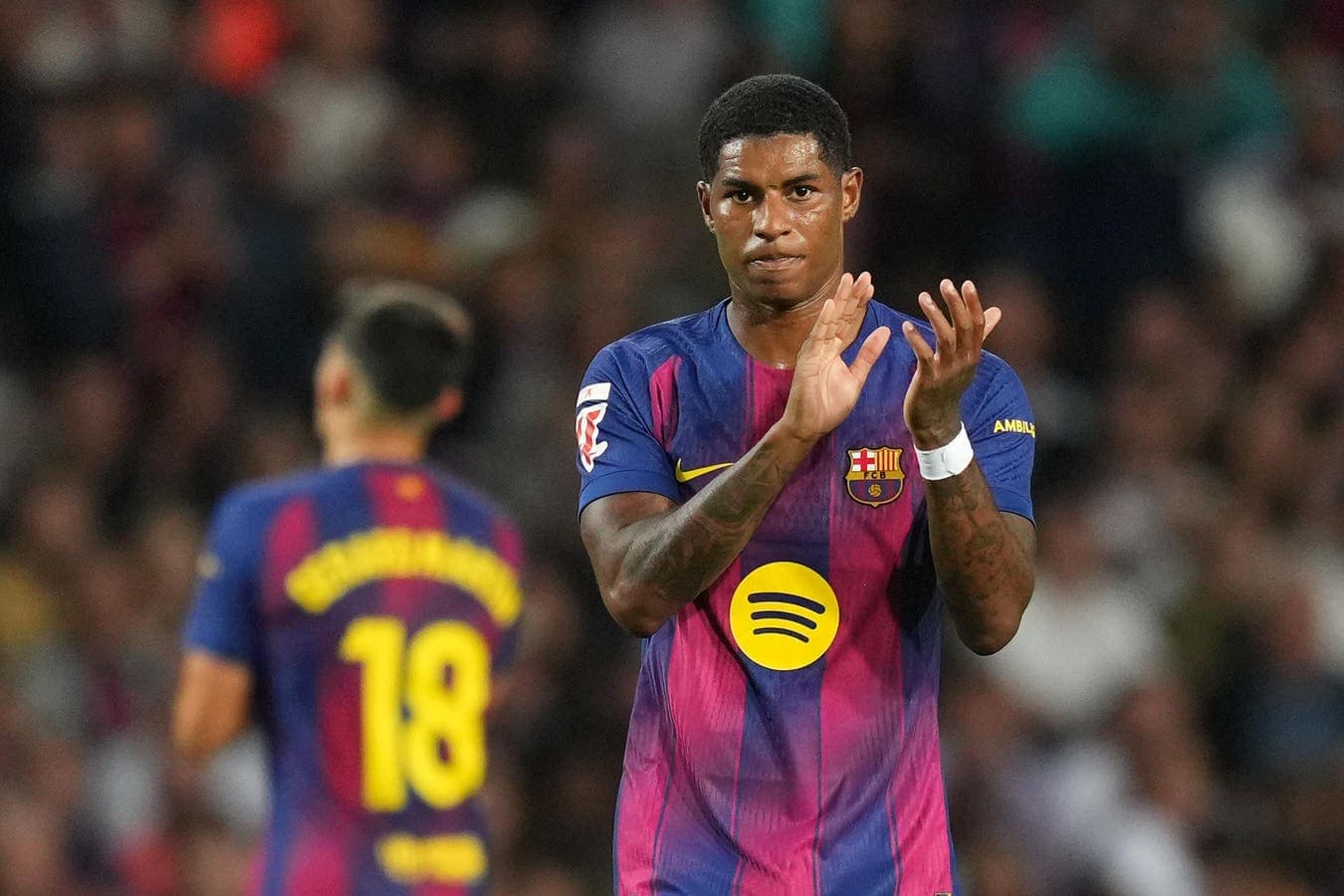 Barcelona player applauding during match at stadium