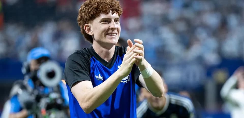Player celebrating and applauding fans after match