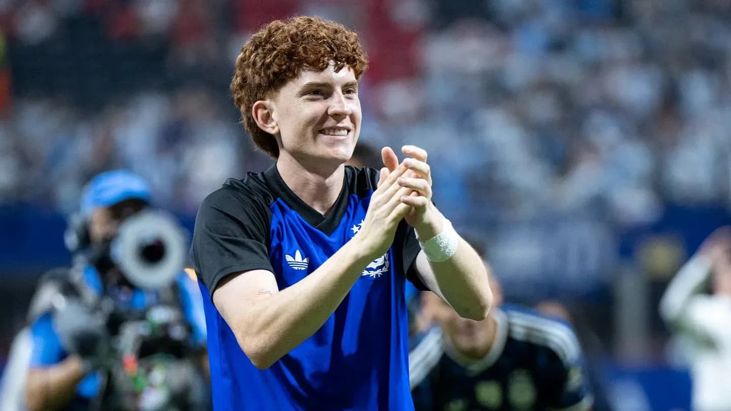 Player celebrating and applauding fans after match