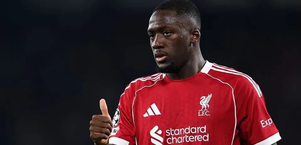Player in Liverpool kit giving thumbs up gesture