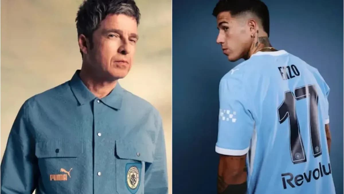 Two men in Manchester City apparel posing together
