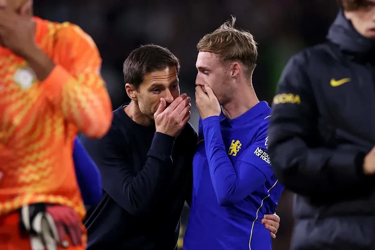 Coach speaking with player after the match