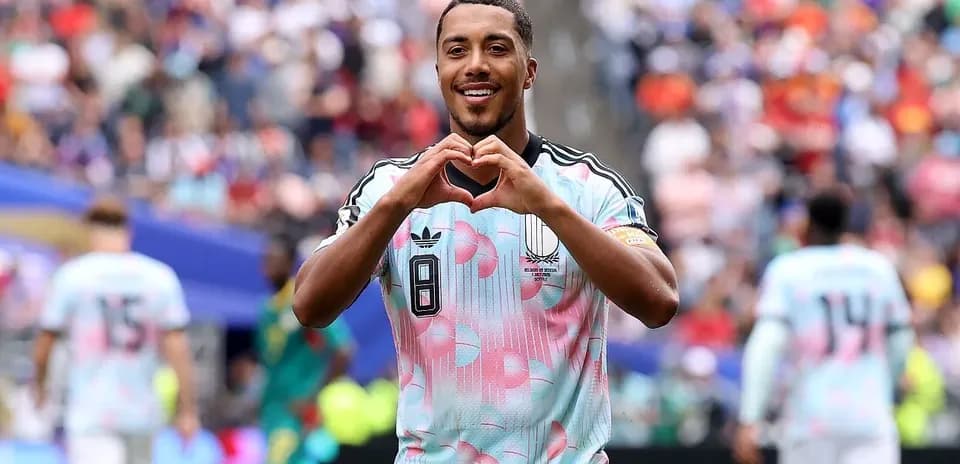 Player celebrating by making heart shape gesture