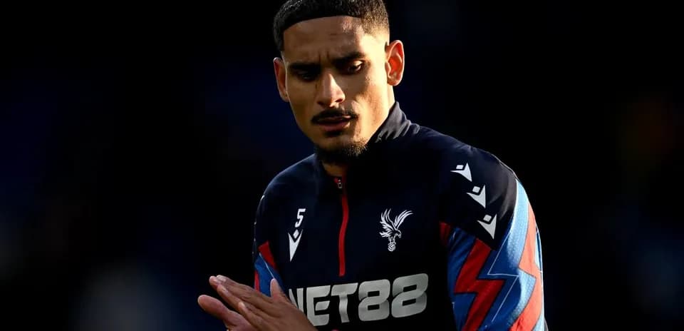 Player in Crystal Palace training kit preparing for match