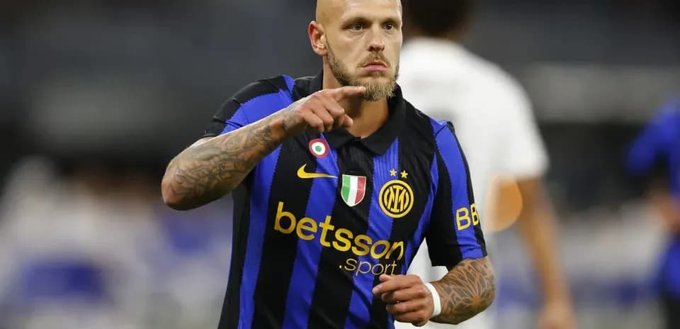 Player celebrating with a gesture in Inter Milan jersey