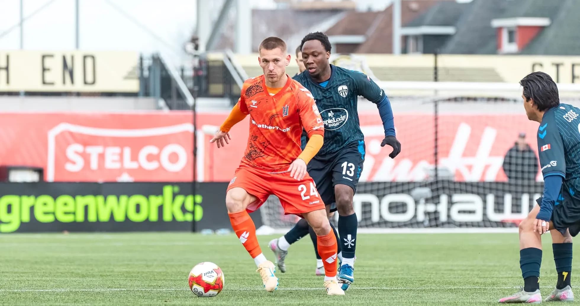 Player dribbling the ball during match action