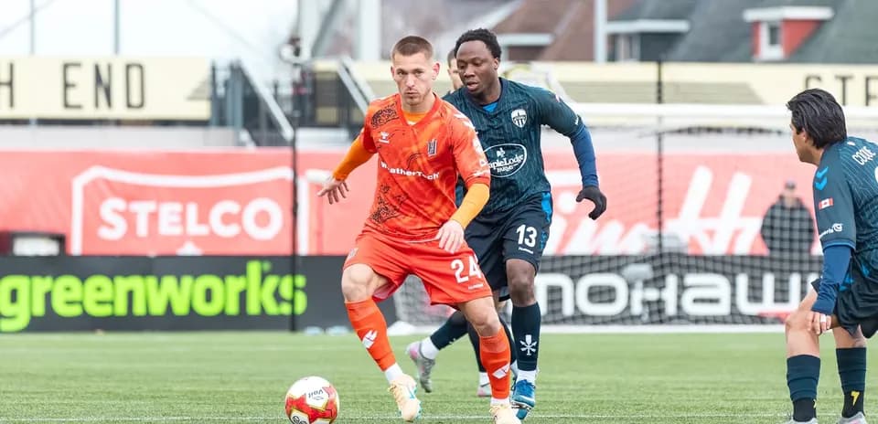 Player dribbling the ball during match action