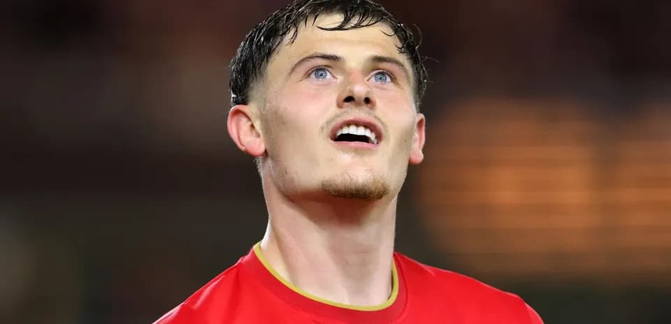 Player in red jersey looking up during match
