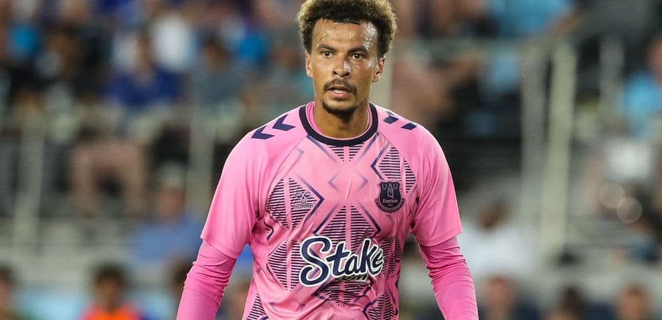 Goalkeeper in pink kit during match action