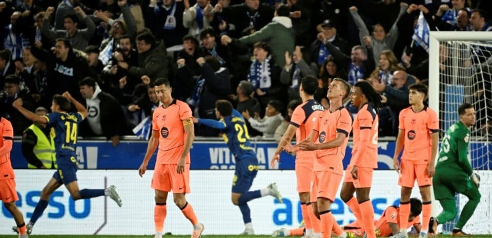 Players in pink uniforms during a match celebration