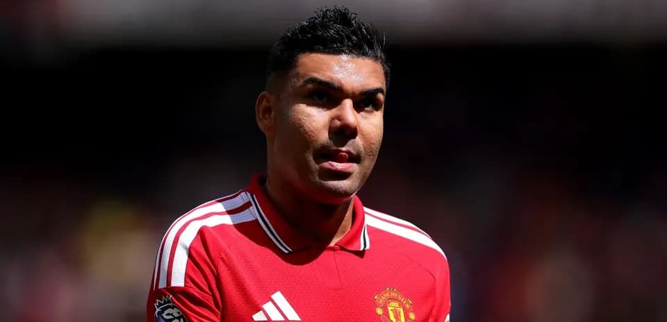 Player wearing Manchester United jersey on field