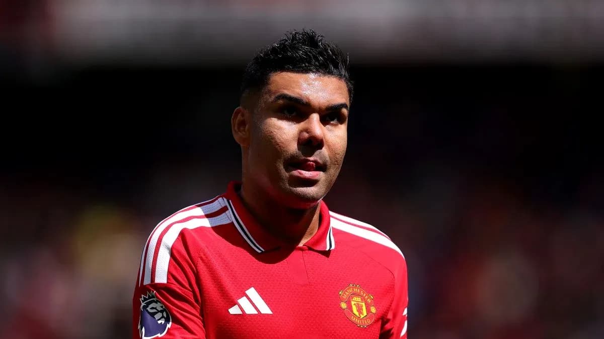Player wearing Manchester United jersey on field