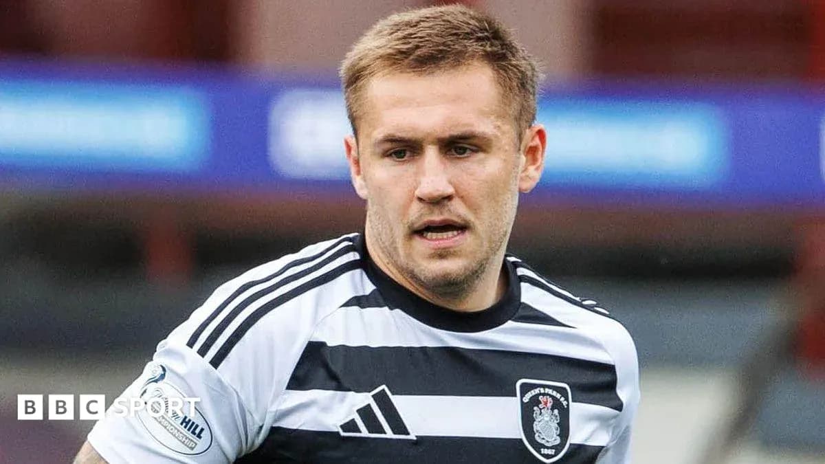 Player wearing black and white striped jersey on field