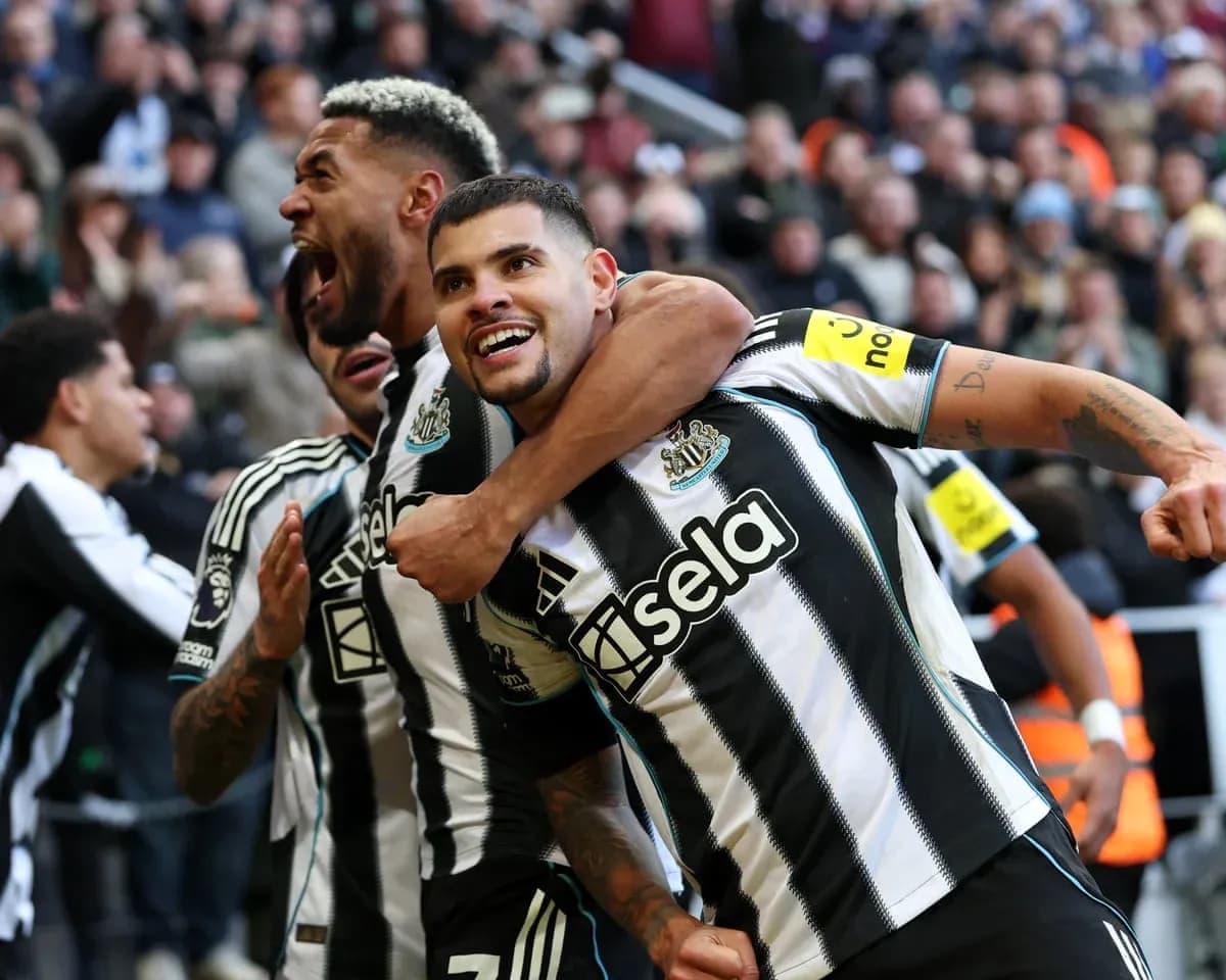 Newcastle players celebrating a goal during match