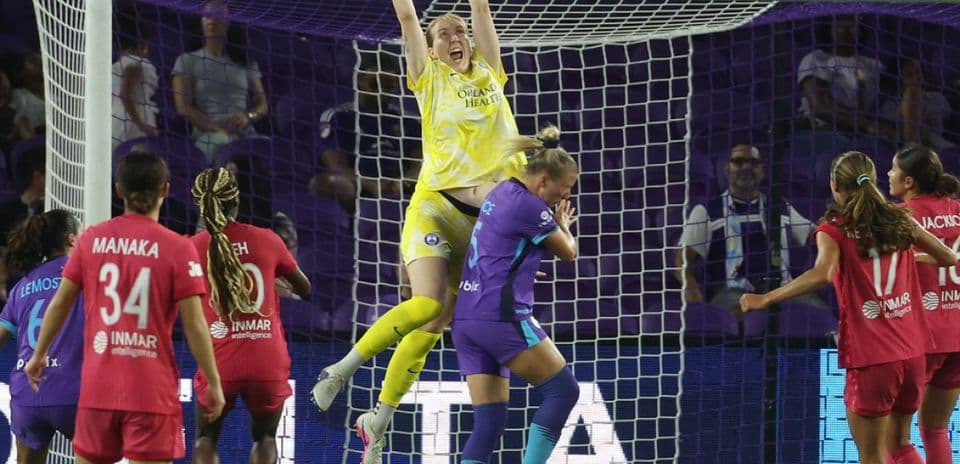 Goalkeeper catching the ball during match action