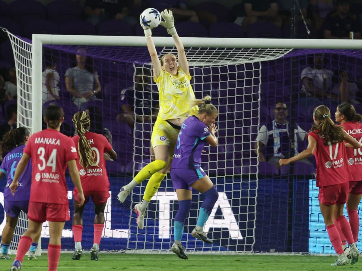 Goalkeeper catching the ball during match action