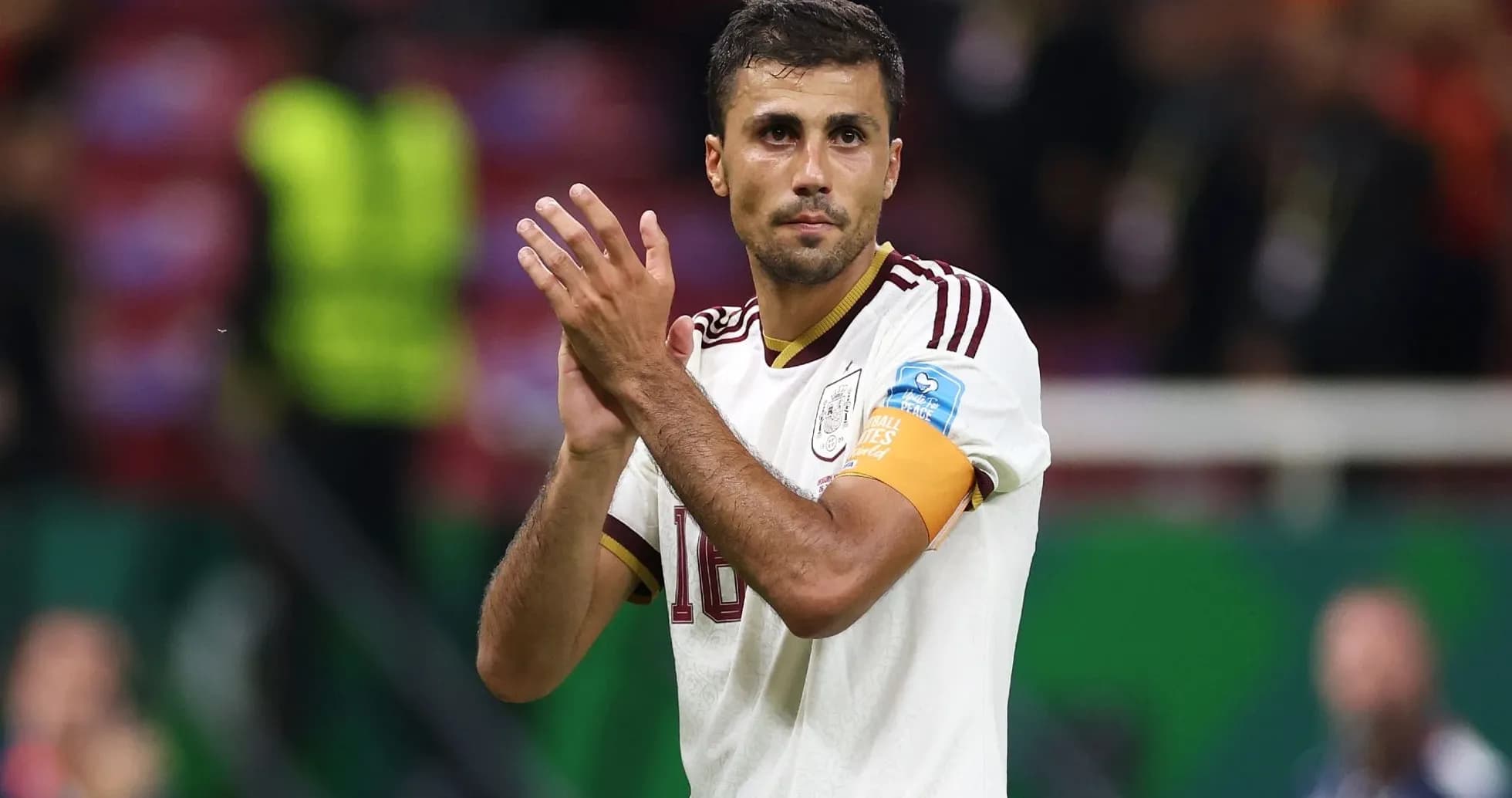 Player applauding fans wearing team jersey